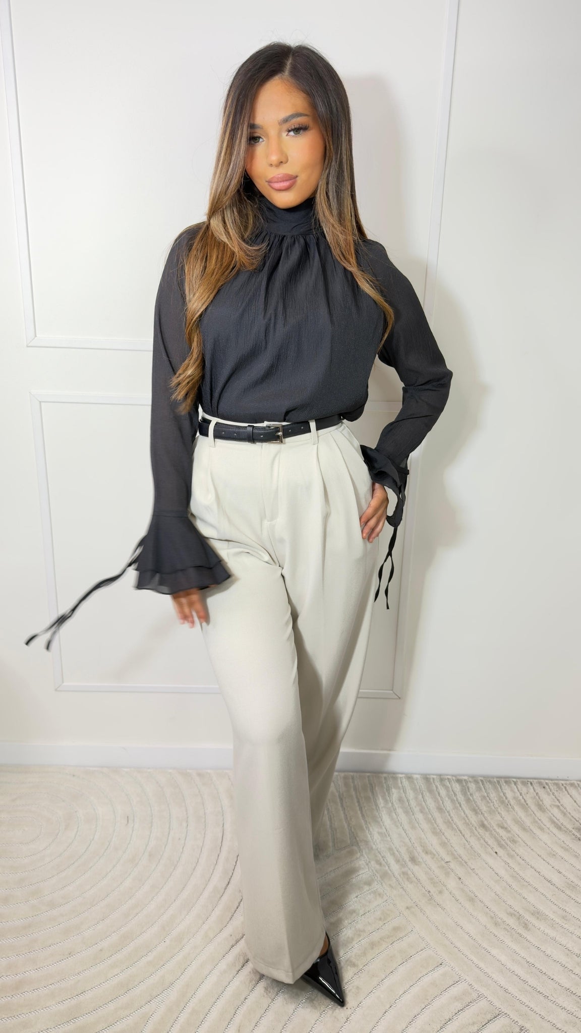 High-waisted pleated trousers