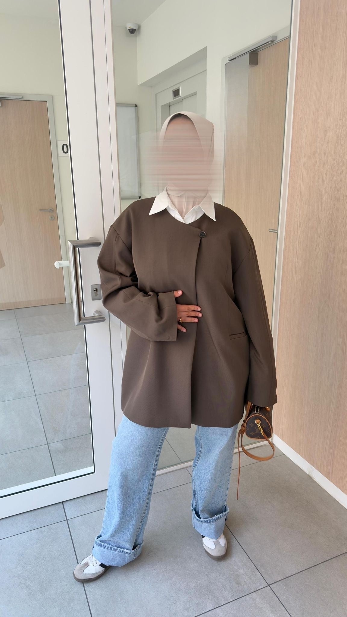 Clean, oversized jacket with a round neck