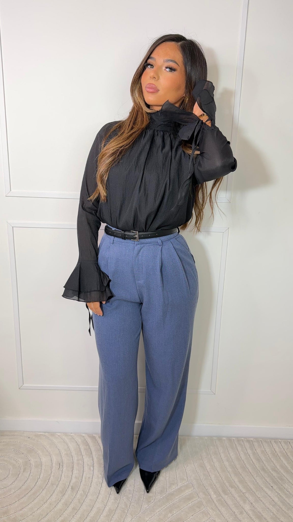 High-waisted pleated trousers