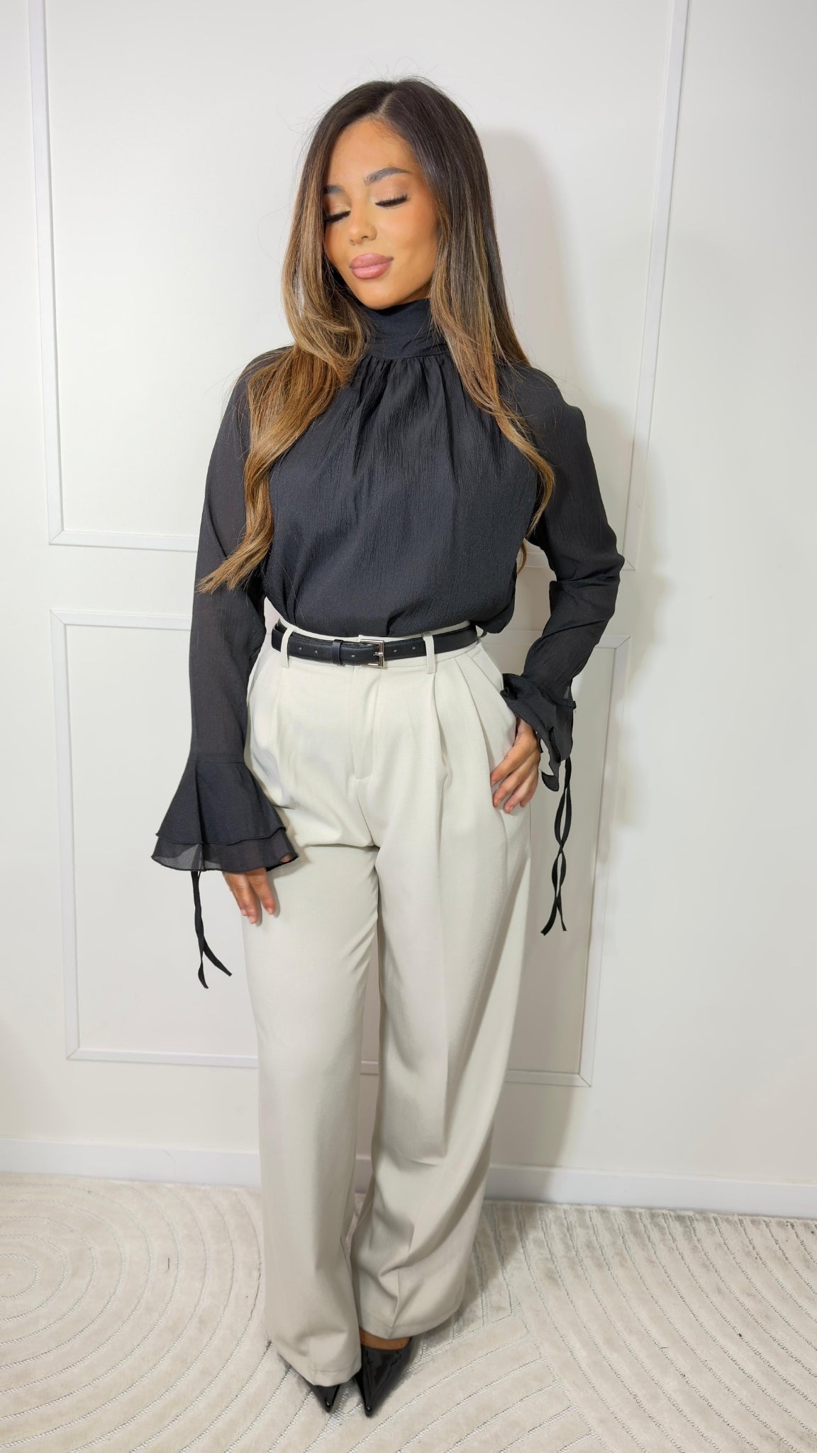 High-waisted pleated trousers