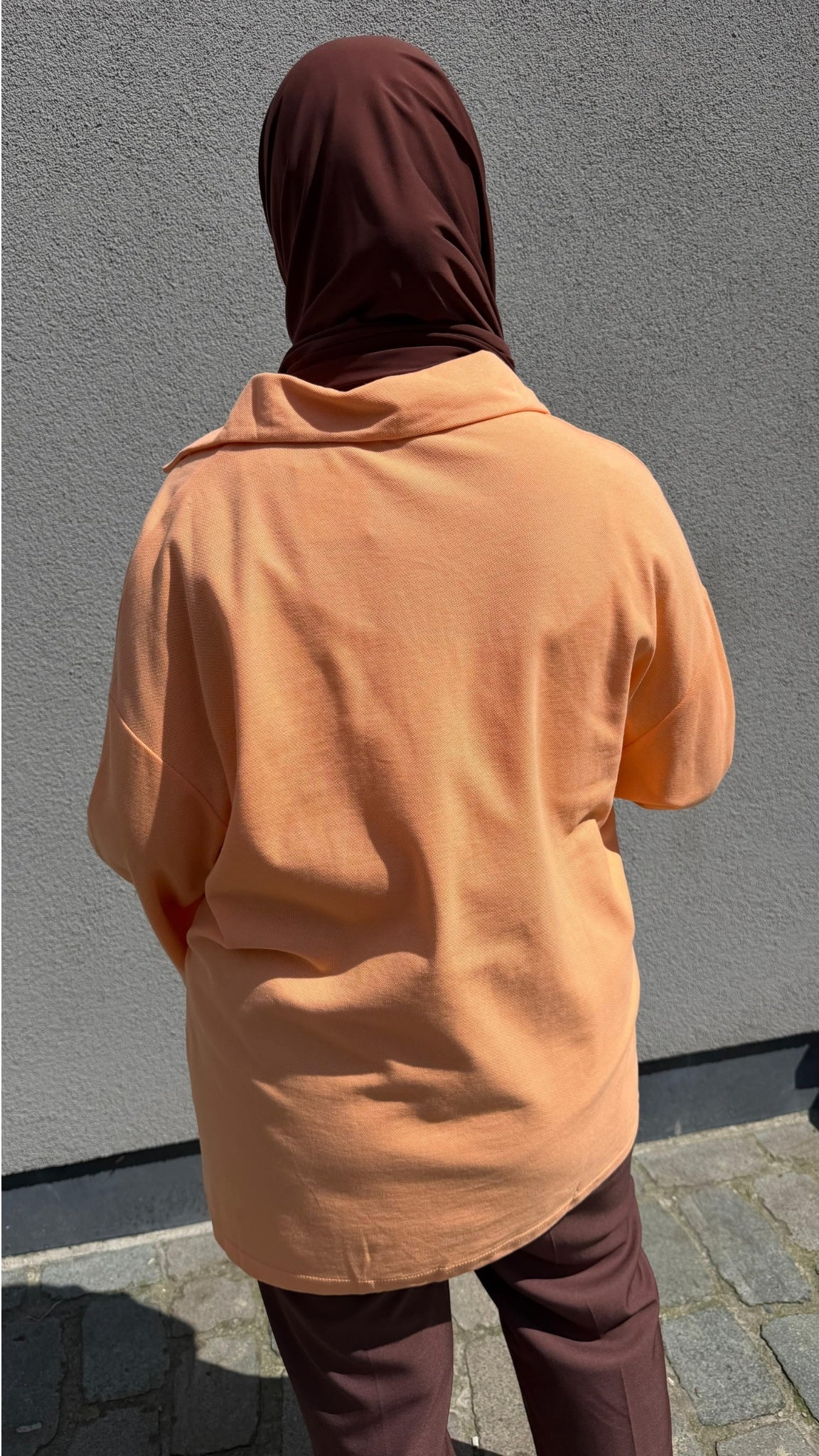 Loose-fit button-down polo shirt
