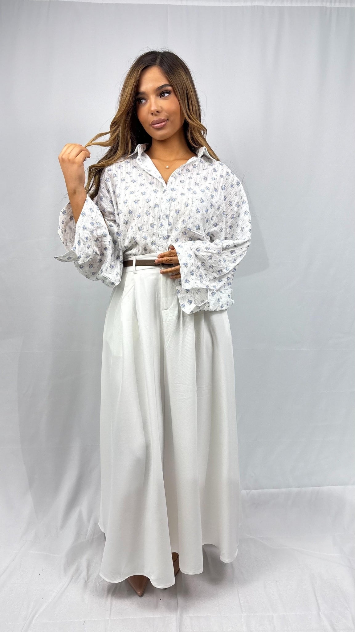 Flared asymmetric floral blouse